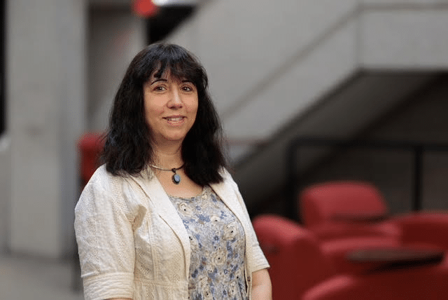 Image of Professor Beth McNutt-Clarke, taken inside an academic building.