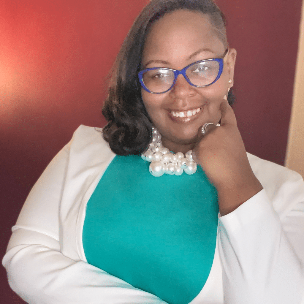Image of Tanisha Williams in front of a red background.